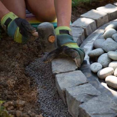 closeup-shot-of-a-handyman-arranging-cobblestones-2023-11-27-05-21-05-utc